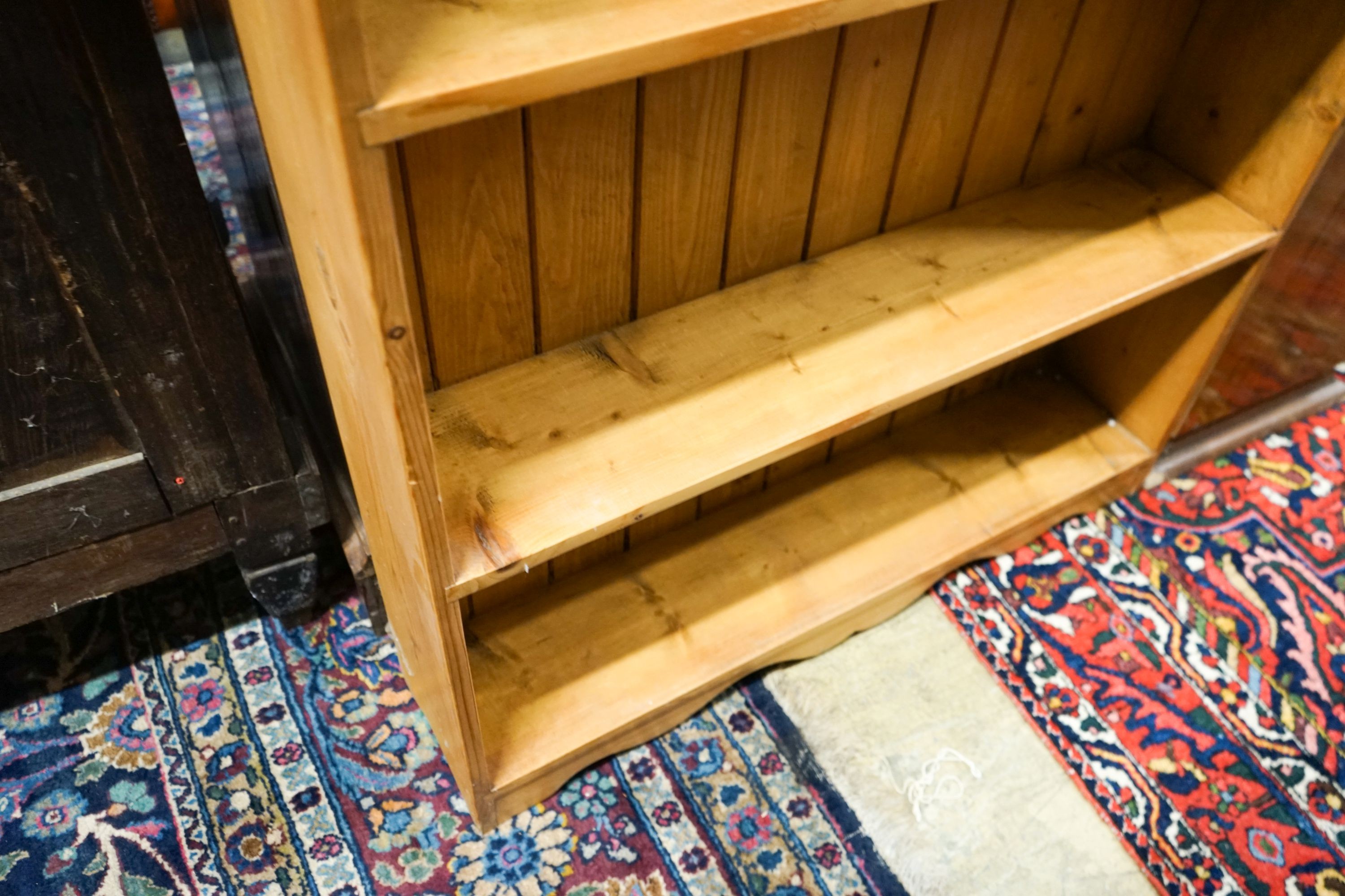 A Victorian style stripped pine open bookcase, width 89cm, depth 20cm, height 120cm